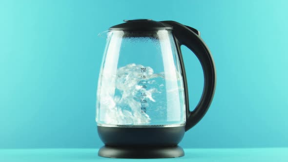 An Electric Kettle with Transparent Walls. Process of Boiling. Full Shot