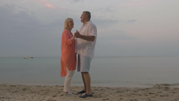 Senior Couple Dancing on the Beach