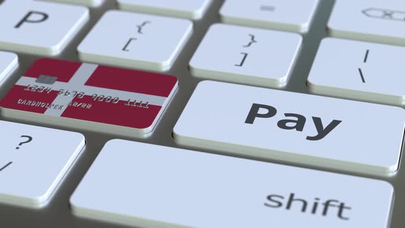 Bank Card with Flag of Denmark As a Key on a Keyboard alt
