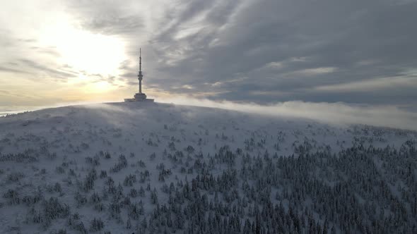 Drone view sunrise in Praděd, Czech republic. Mast tower on winter.