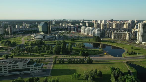 Top View of the National Library and a New Neighborhood with a Park in Minsk at Sunset