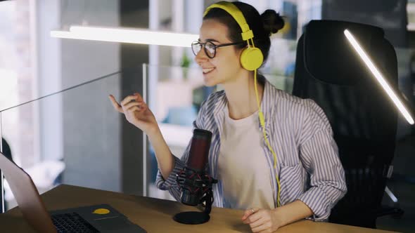 Woman Radio Host on Air in Studio