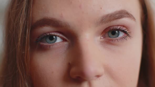 Closeup Macro Portrait of Beauty Young Beautiful Woman's Eyes Smiling Model Looking at Camera