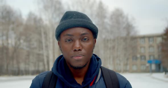 One Black Man Serious Looking at Camera Close Up Confident American Face .