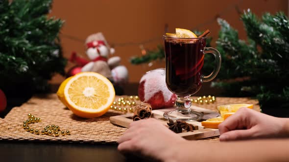 Waiter Bringing Mulled Wine To a Visitor