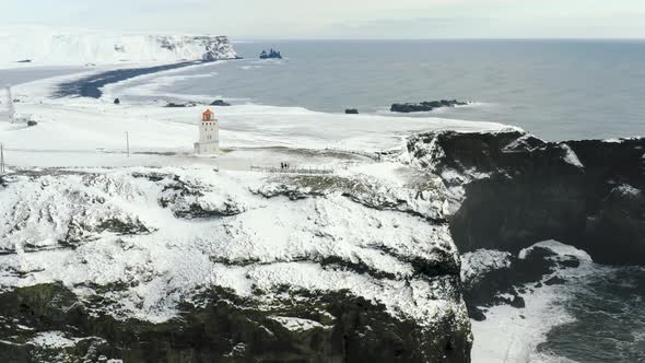 Aerial View of Iconic Black Sand Beach Around Reynisfjara Beach and Dyrholaey Lighthouse