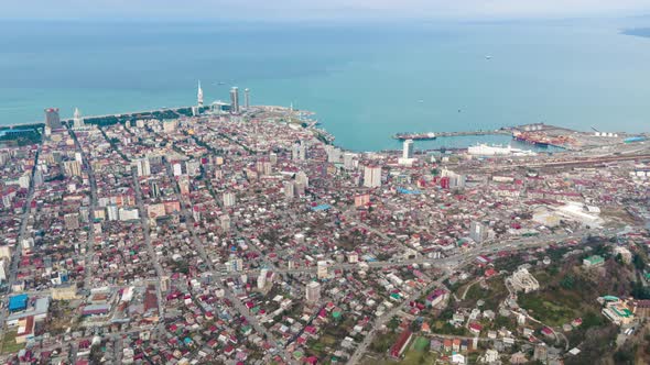 Aerial hyperlapse of International Marine Station pier in Batumi city. Black Sea harbor and bay