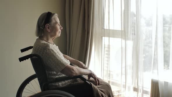 Disabled Elderly Woman on Wheelchair