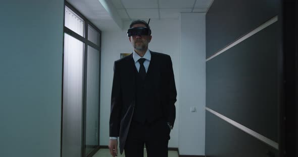 Businessman Using VR Glasses in Office Corridor