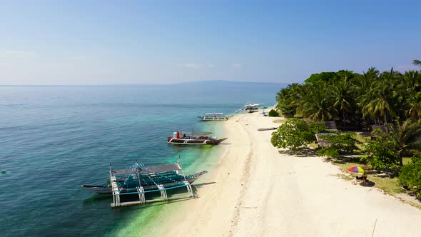 White Sand Beach and Boats with Tourists Top View