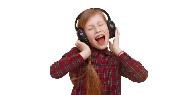 Lovely Active Elementaryschool Aged Caucasian Girl Listening Music Through Headphones Dancing