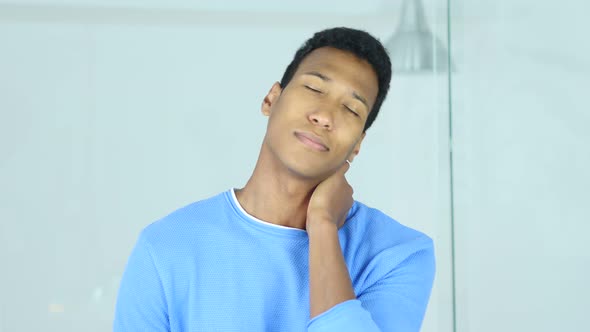 Afro-American Man at Work with Neck Pain