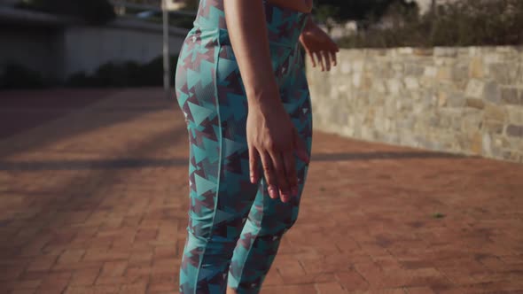 Fit woman stretching in a park