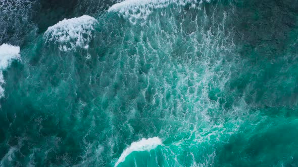 Aerial View To Ocean Waves. Blue Water Background