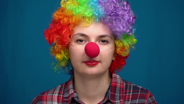 Portrait of a Clown on a Blue Background