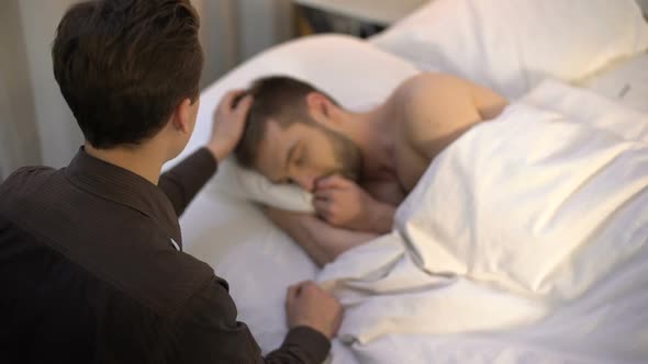 Young Man Stroking Sleeping Partner Head Homosexual Couple Tender Relations