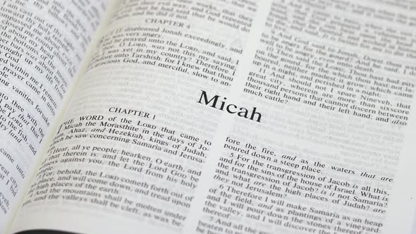 Close Up Shot of  Bible Page Turning to the book of Micah