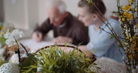 Grandfather Writing Letter During Easter Holidays