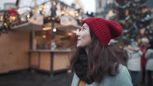 Portrait of Beautiful Young Woman in a Center of Christmas Fair