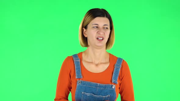 Woman Showing Disgust for Bad Smell or Taste. Green Screen