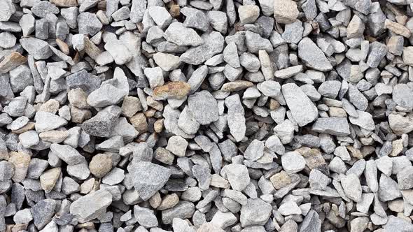 Texture of Small Black Rubble Lying on the Ground Closeup Slow Motion