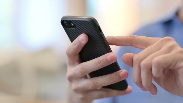 Close Up of Hands of African Woman Using Smartphone