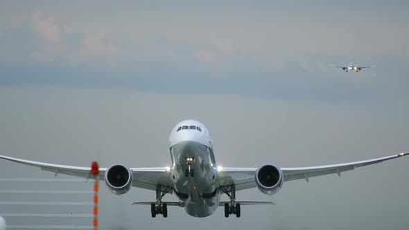 Twin Engine Widebody Airplane Take Off in the Morning