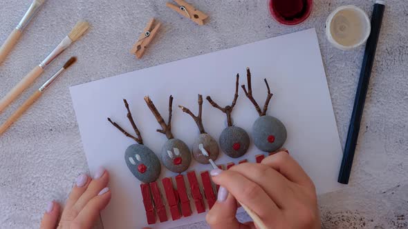 Making Diy Merry Christmas Deer on Greeting Card Postcard Made of Pebbles Sea Stones Clothespins and