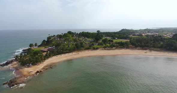 Closing in aerial shot of a coast and beach resort in Mermaids Bay San Pedro in Southwest Ivory Coas