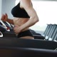 Close up of Muscular Young Woman s Body During Cardio Exercises in the Sport Gym. - VideoHive Item for Sale