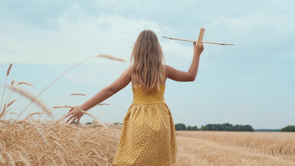 Happy Girl Child Run on Wheat Field with an Airplane / Videohive, Stock footage, Sports