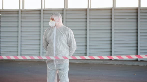 Man Epidemiologist Showing Stop Sign Standing Restricted Area Warning Red White Tape Coronavirus