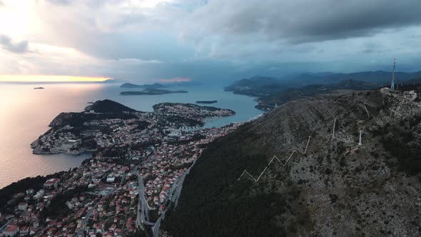 Ocean town drone shot during sunset of Dubrovnik in Croatia.