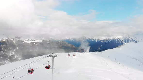 Winter Panorama with Ski Lifts and Snow Covered Mountains on a Sunny Day