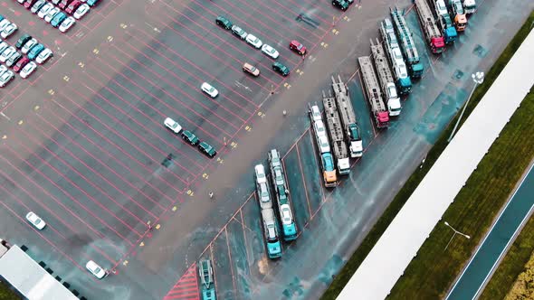 Loading New Cars Onto Trucks for Transportation Aerial View