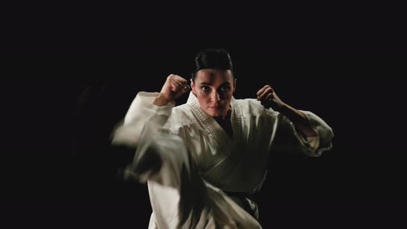 Young Woman in Kimono Practicing Karate