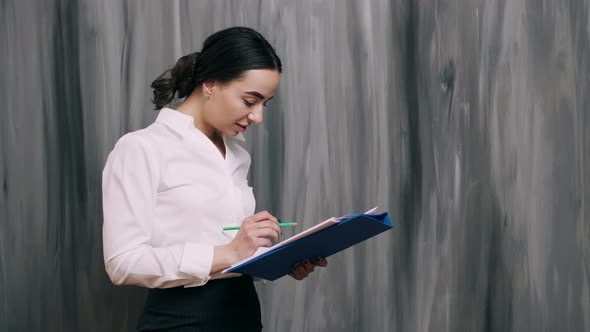 Portrait of Business Woman on Gray Background