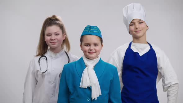 Confident Little Girl in Stewardess Uniform Crossing Hands Looking at Camera Smiling with Caucasian