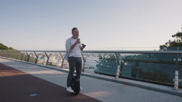 Man Eats Pizza and Drinks Coffee Riding Electric Unicycle