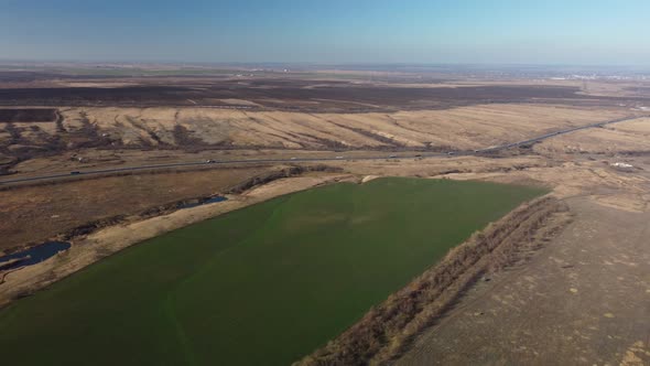 a Highway Stretching to the Horizon Among Agricultural Fields