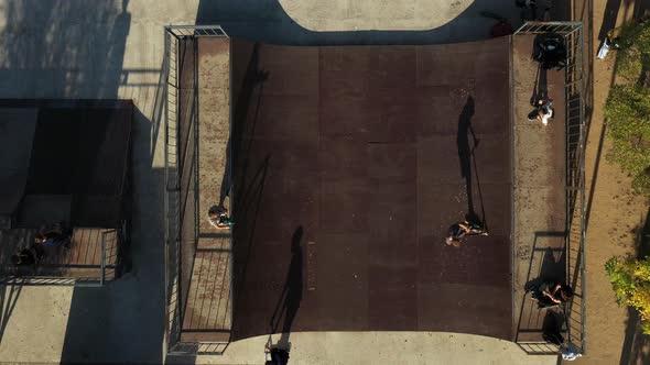 Children Ride on the Outdoor Skateboard Court