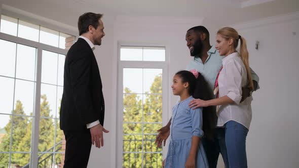 Broker Giving House Keys To Happy Little Homeowner