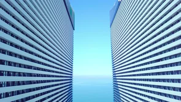 the drone flies between two buildings with glass windows.