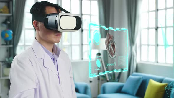 Male Doctor Using VR Glasses Virtual Reality Working On 3D Human Body Parts