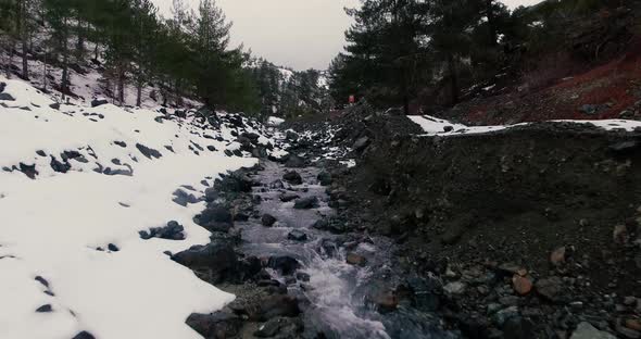 Drone shots of stream and small waterfalls created by melting snow in Troodos Mountain Cyprus.