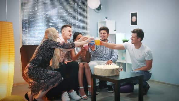 Multiethnic Young People Making Toasts with Dry Ice Cocktails on Birthday Party