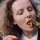 Young Woman Eating Grilled Veggie Off a Skewer with a Pleasure. Healthy Vegan Party Food Options.  - VideoHive Item for Sale