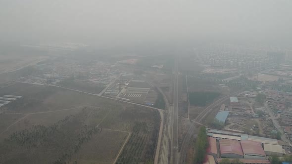 Rural Poor Village Outside Beijing with Farmland and Train Tracks During Extreme Pollution Day