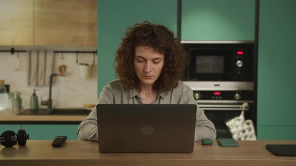 Young 20s Adult Student Working in Her Kitchen