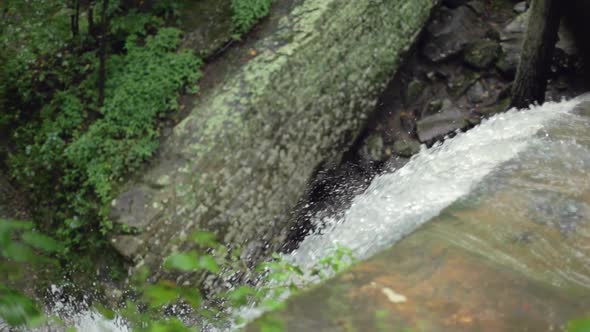 Top of Waterfall Detail in Shallow Focus and Slow Motion